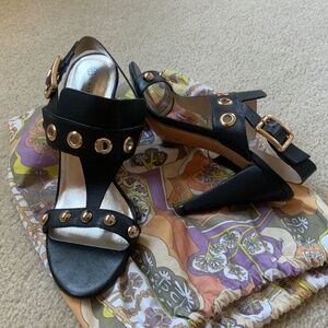 Black leather Trina Turk gold trimmed 4 inch heeled sandals
